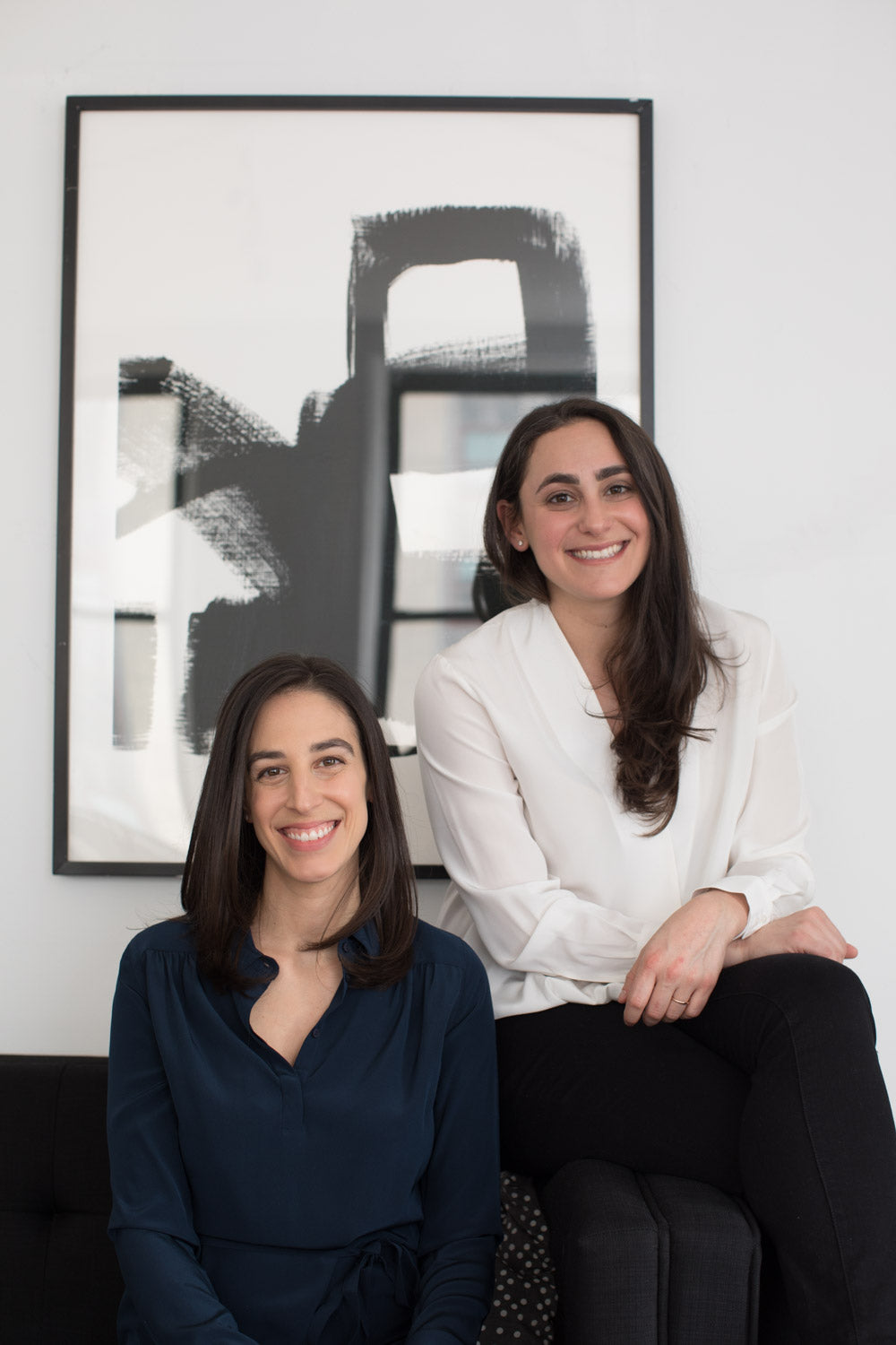 Front view of Cofounders Jordana and Alex seated