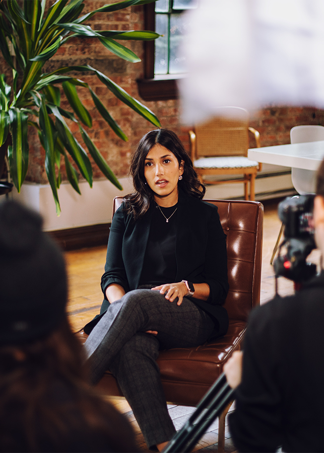Front view of a LOLA expert seated in an armchair