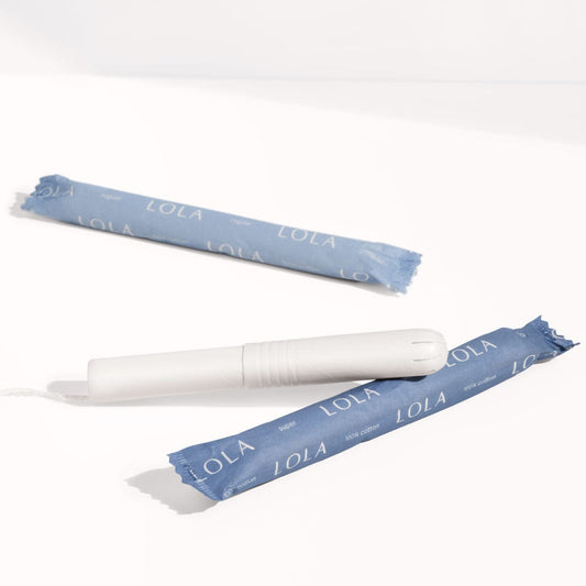 Cardboard applicator tampons| View of 2 cardboard tampons, one wrapped and one unwrapped