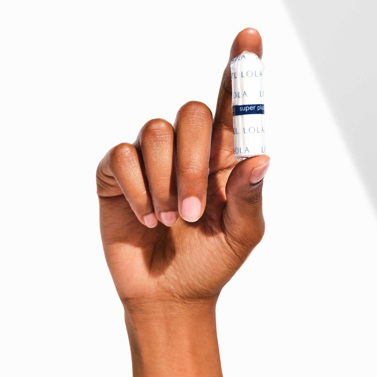 Non-applicator Tampons | View of a women holding 1 non-applicator tampons in her hand